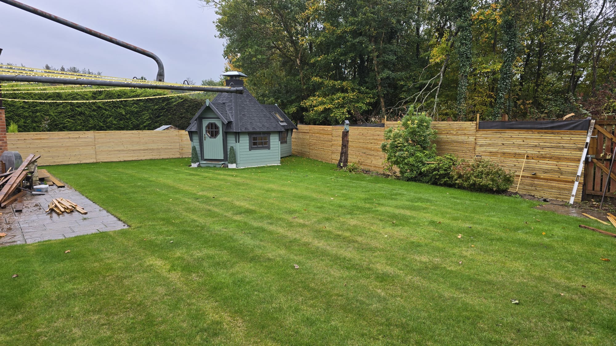 Wooden slat fence installation